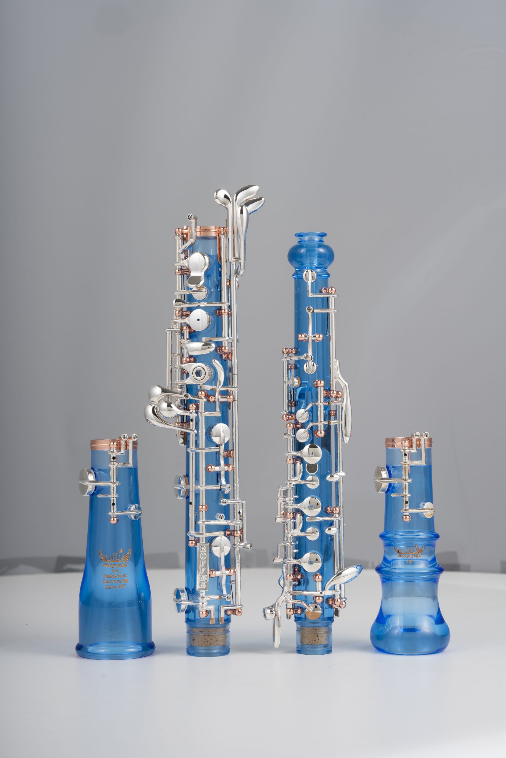 Professional Performance Level Oboe Blue Acrylic Transparent Body Semi Automatic Rose Gold Posts Silver Plated Keys and a Double-Bell Design